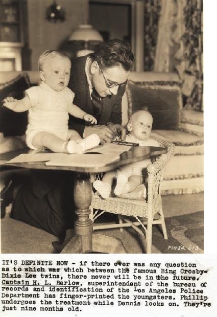 Captain H.L. Barlow fingerprinting Bing Crosby's twins 1935